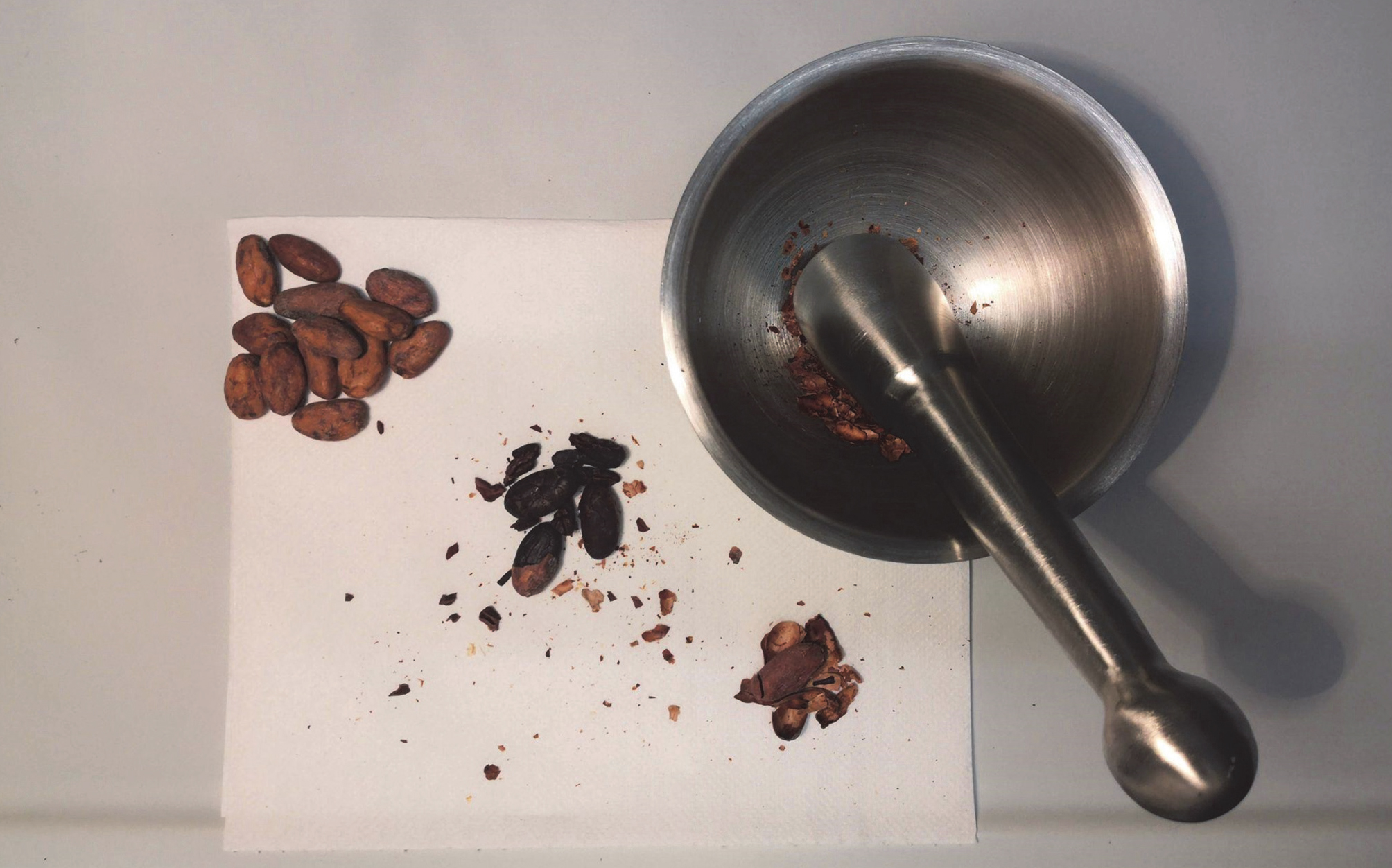 Cocoa beans processed with mortar and pestle